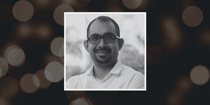 Ashish Arora's photo against a background showing blurred lights