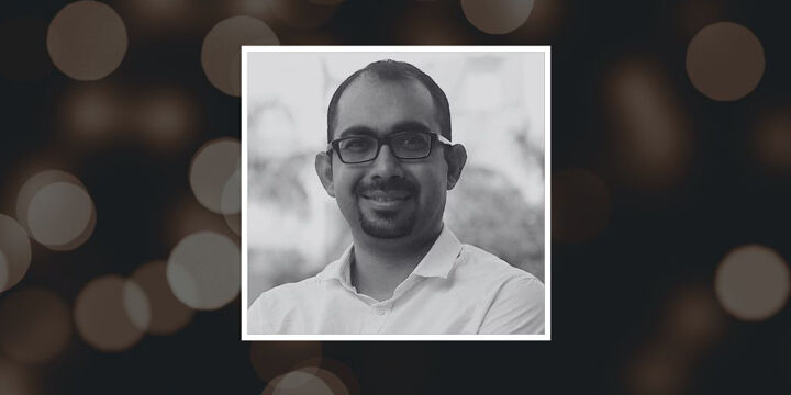 Ashish Arora's photo against a background showing blurred lights